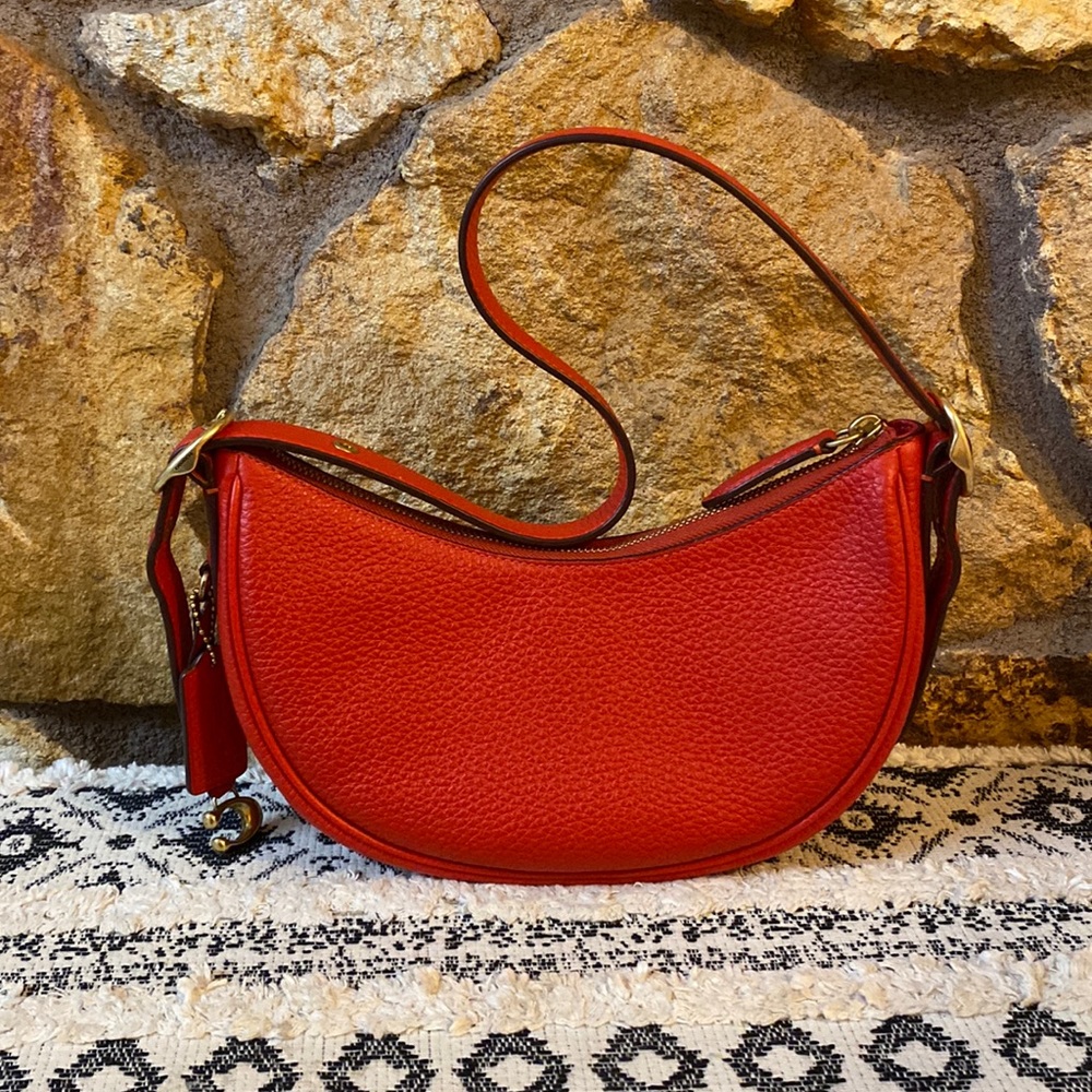 Coach Luna in Red with Brass Gold trim.